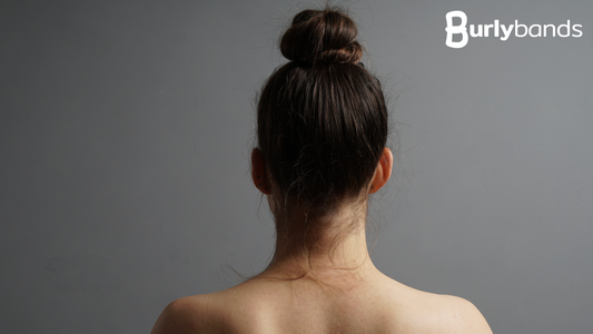 back of woman's hair in top bun
