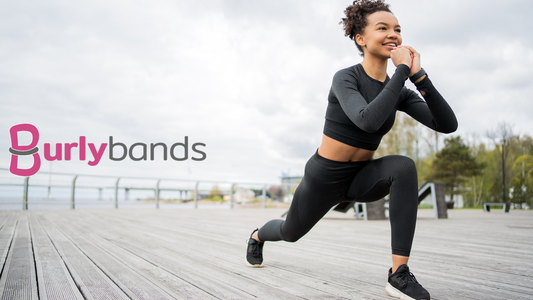 woman in workout gear stretching legs outdoors