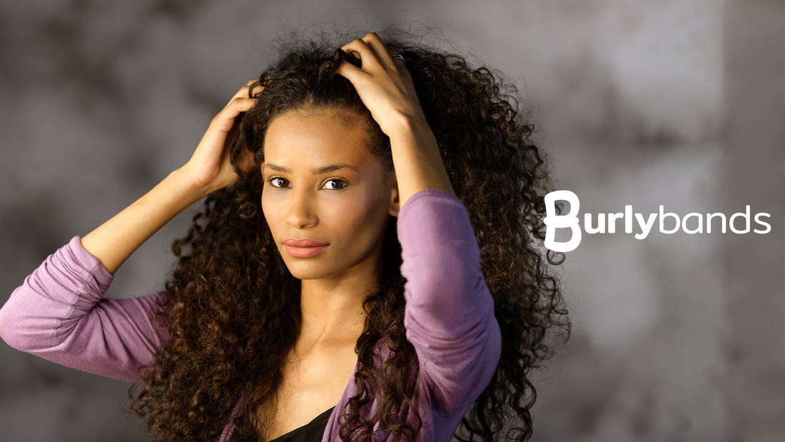 woman running hair through curly thick hair