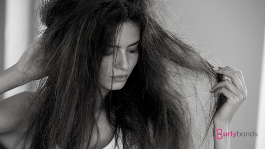 woman holding thick tangled hair