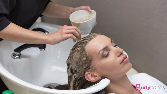 A lady getting her hair washed at the hairdressers