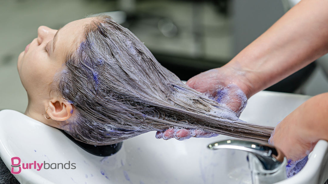 A lady getting her hair bleached at the salon
