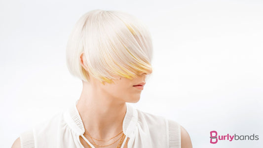 A lady wearing a white shirt with bleached blonde hair
