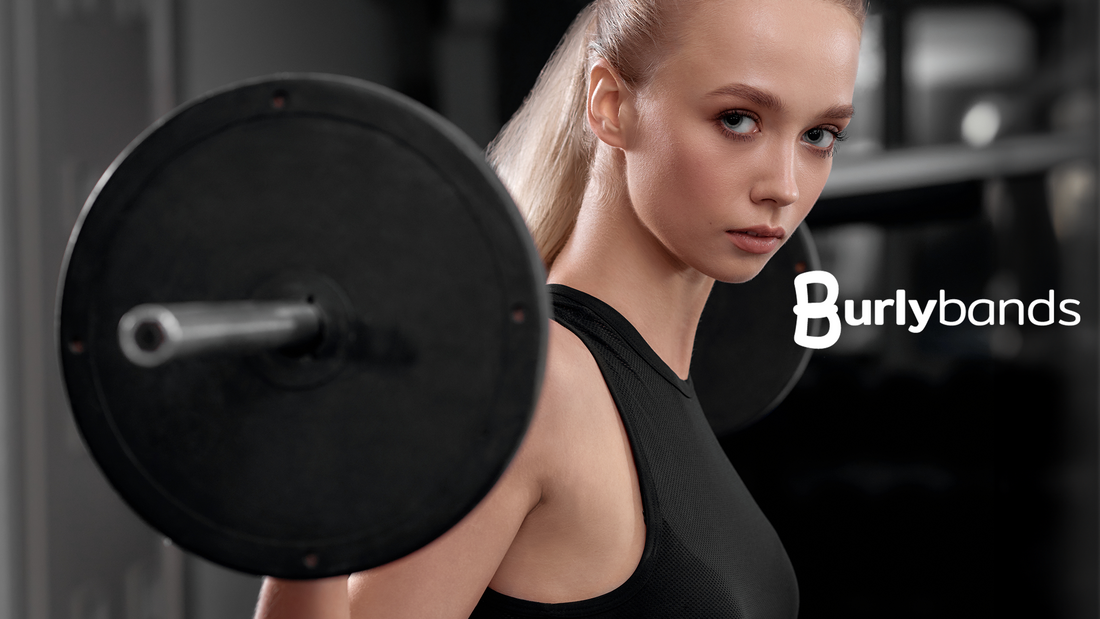 fit woman in black lifting weight at the gym