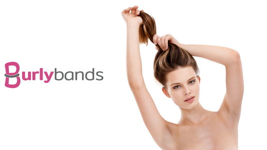 woman holding hair in ponytail over head