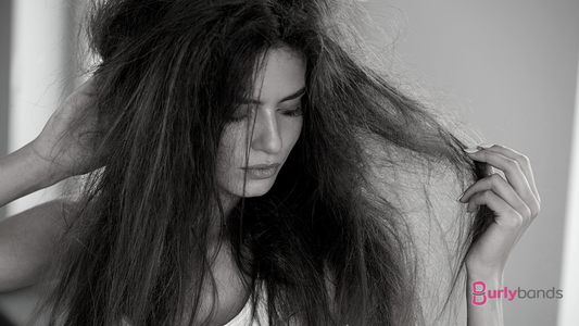 woman holding thick tangled hair 