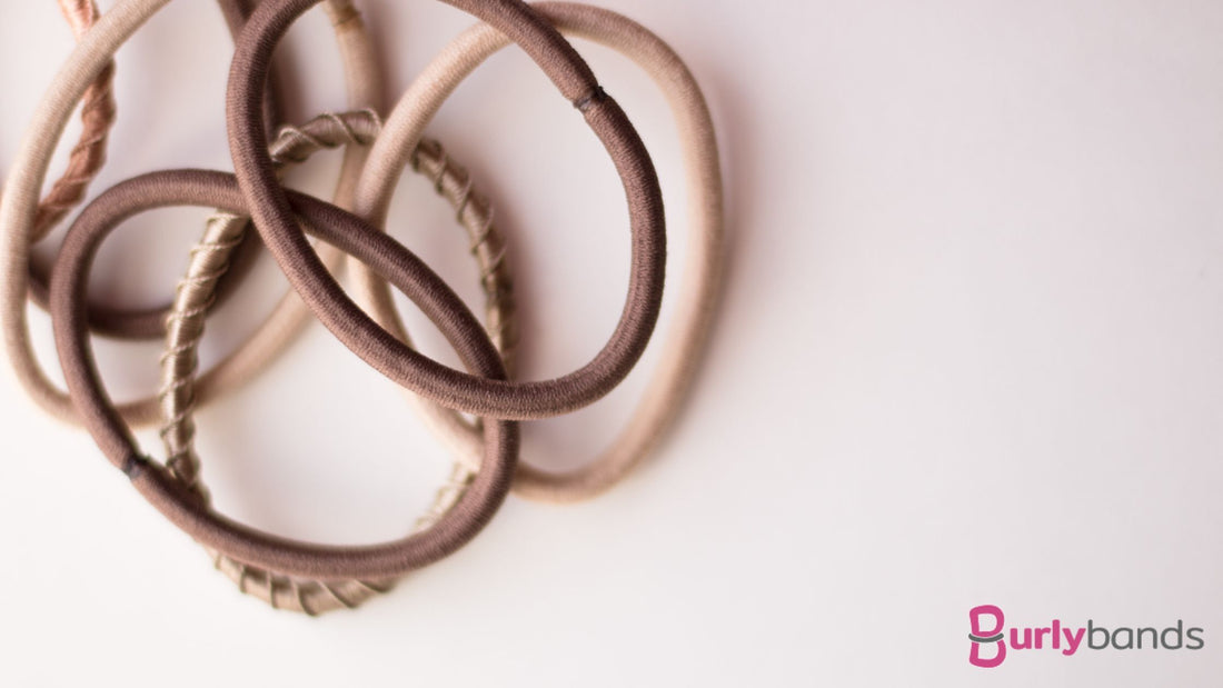 Some hair ties that are in the brown and cream shades