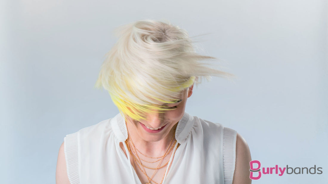 A  lady with blonde hair and a streak of yellow