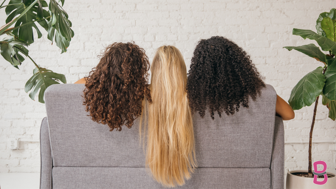3 women sitting on couch back of their hair