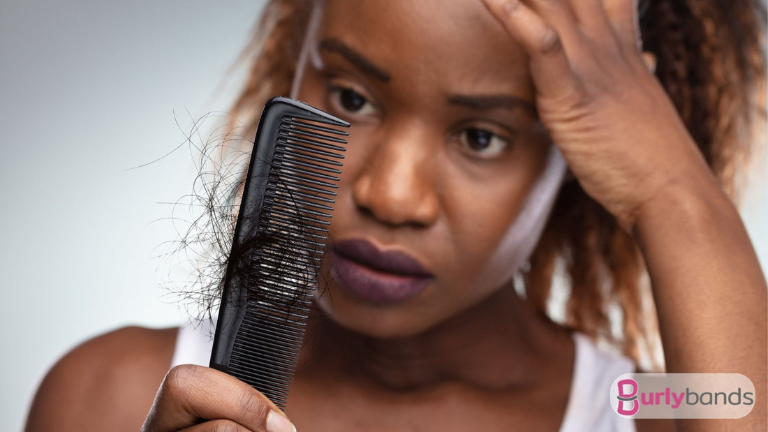 A lady looking at her comb in horror with her hair on it