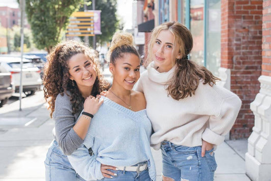 Three girls hanging out together outside