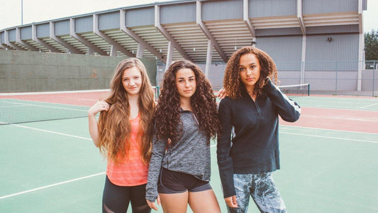 3 girls on tennis court