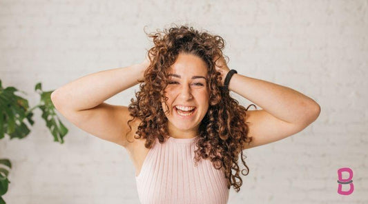 woman touching curly hair